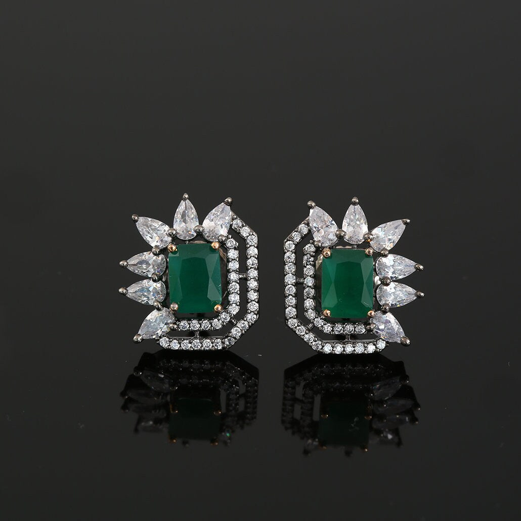 Square cut Clear stone Flower Stud Earrings accented with Rhodium plated Background
