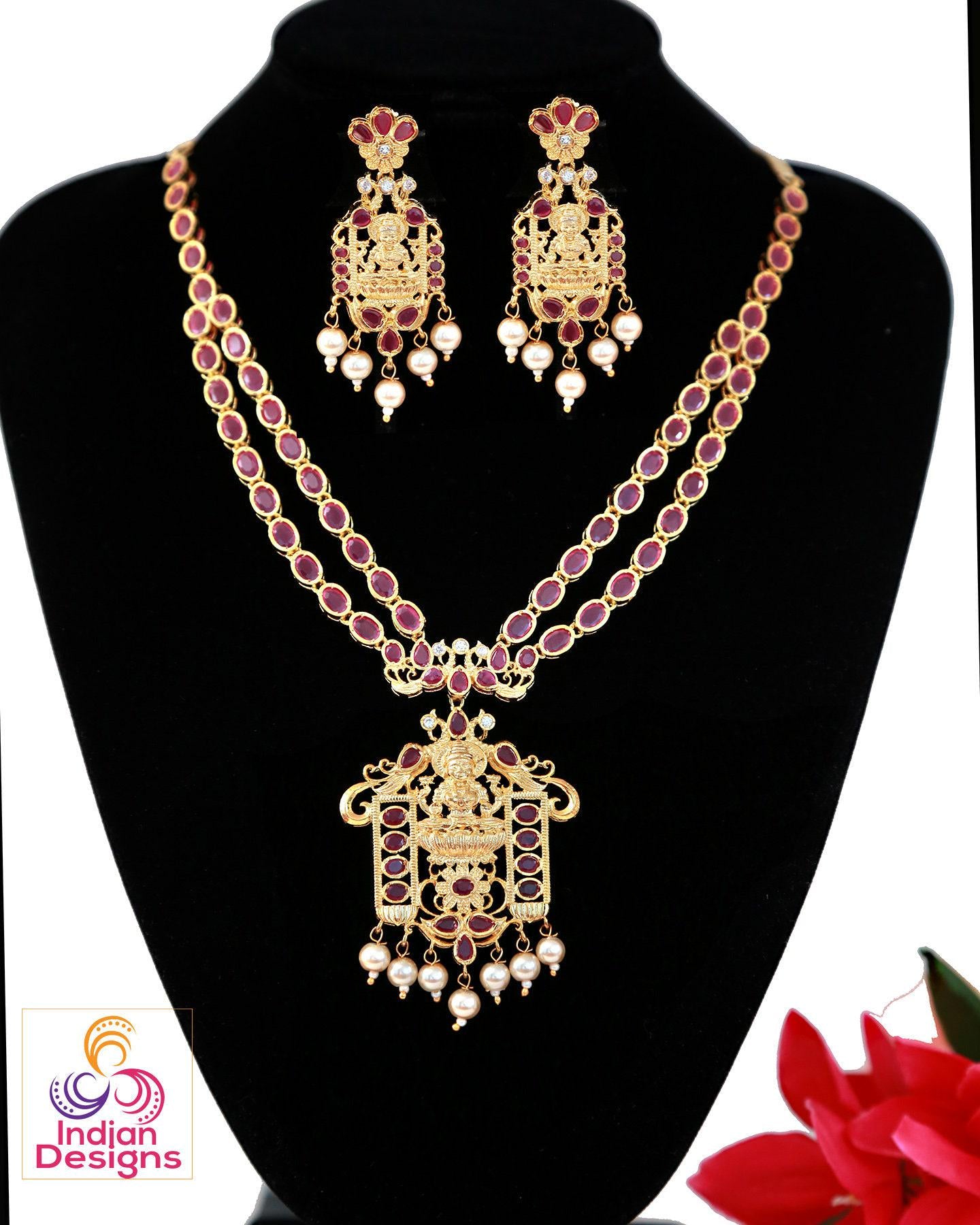 Lakshmi devi necklace designs | gold necklace designs with ruby and emerald stones with lakshmi pendant |indian temple jewelry necklace