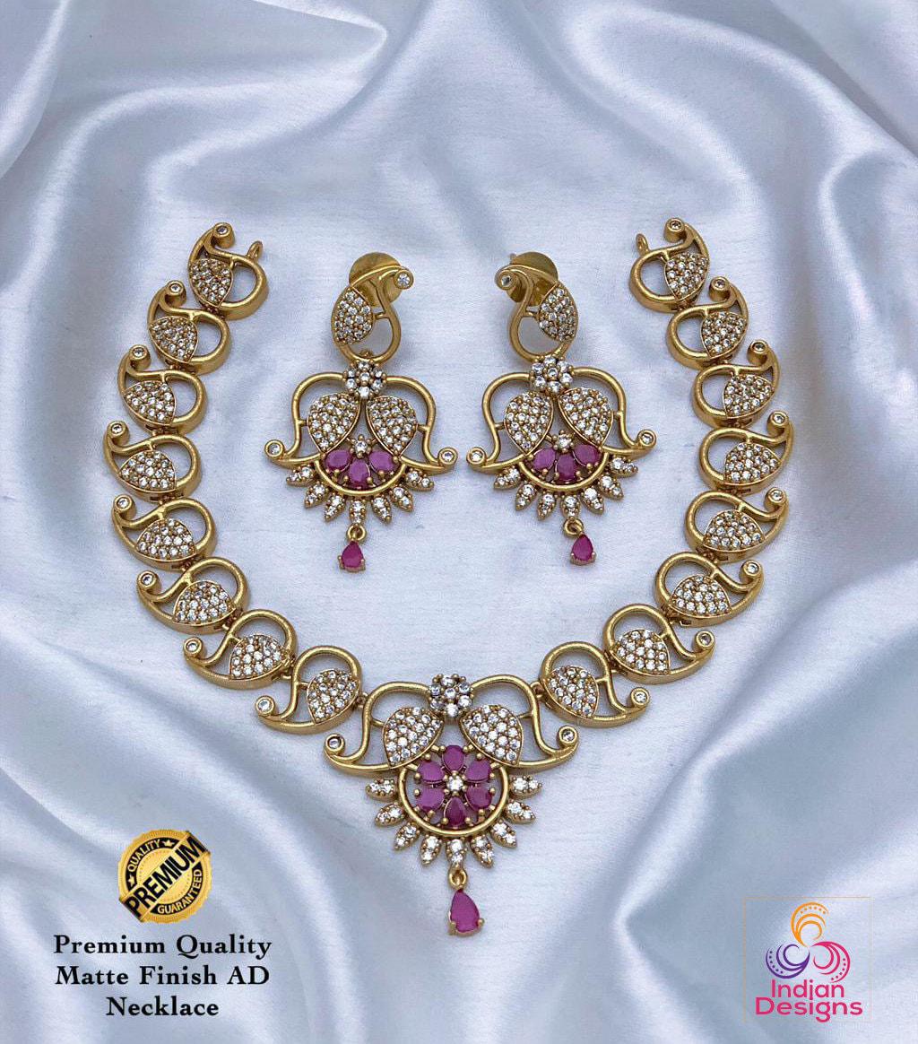 Traditional south indian style choker necklace and earrings set with ruby and emerald accents | indian temple jewelry designs | gift for her