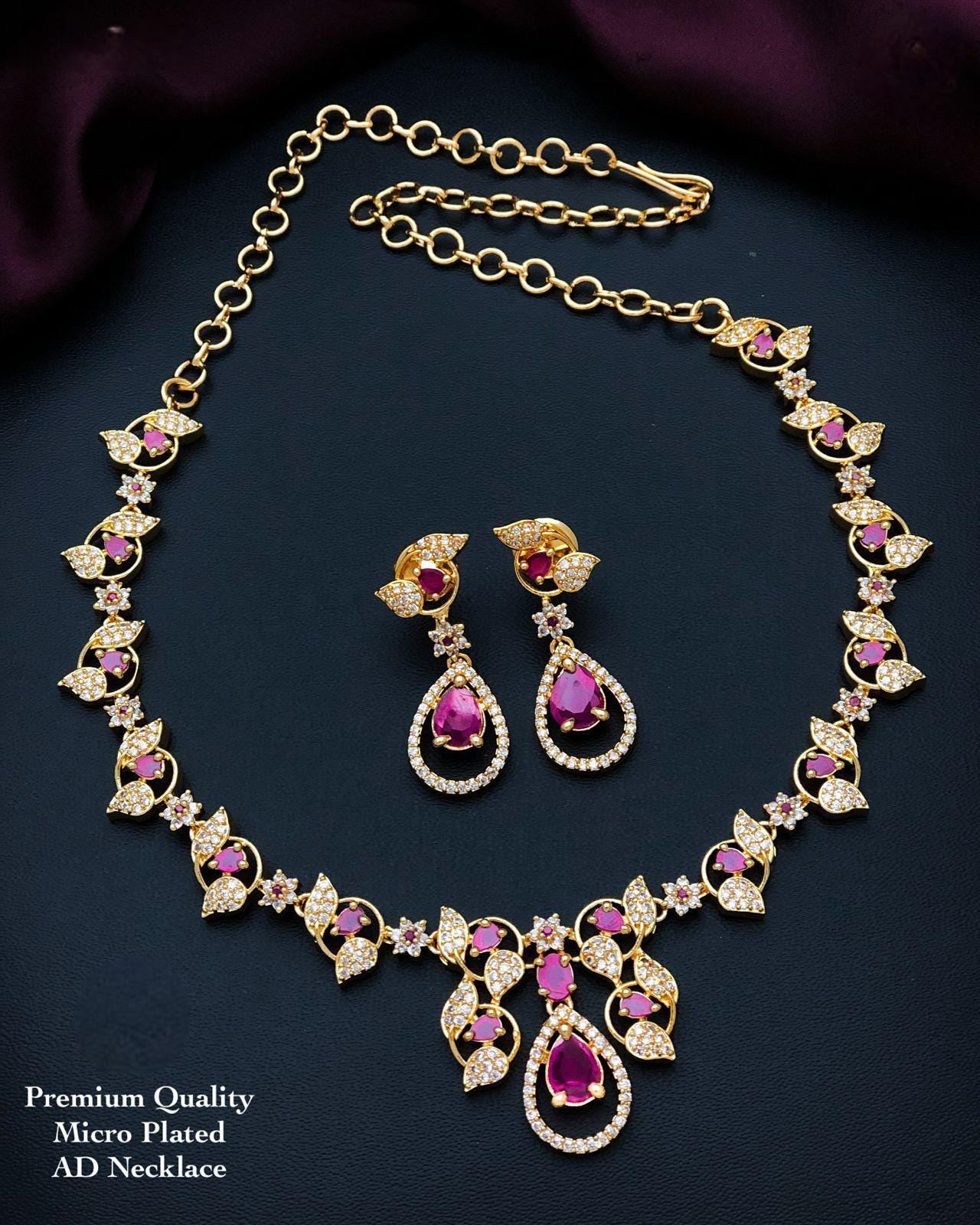 South indian gold choker necklace designs| small gold choker necklace designs with pearl drops and ad stones| american diamond necklace