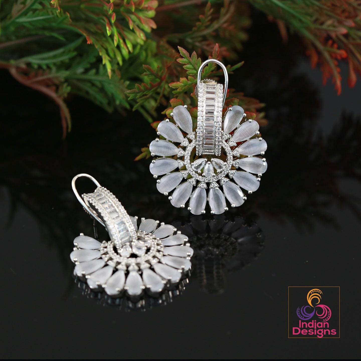 Big flower stud crystal earrings | ad stud earrings peach stones | rhodium plated american diamond stud earrings | bollywood style cz studs