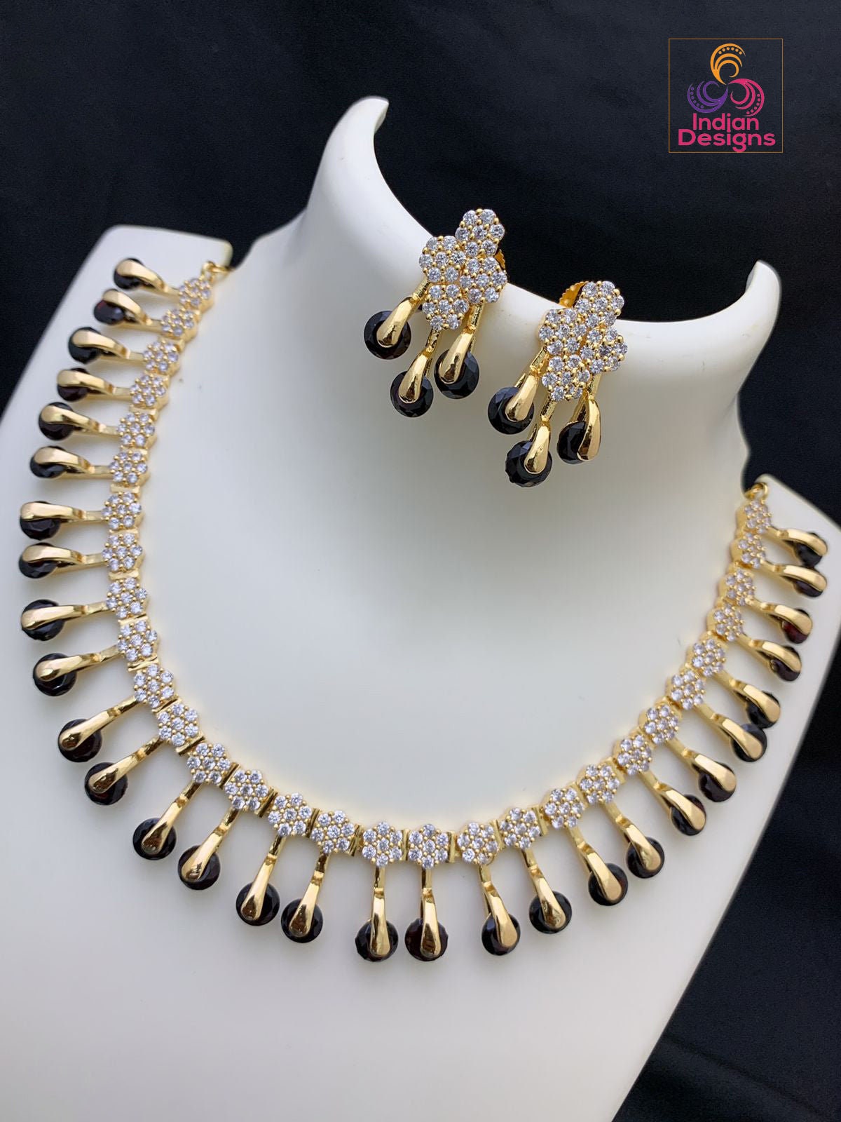 Unique and Exclusive CZ American Diamond necklace Earring set | Gold-plated American diamond necklace set with earrings |