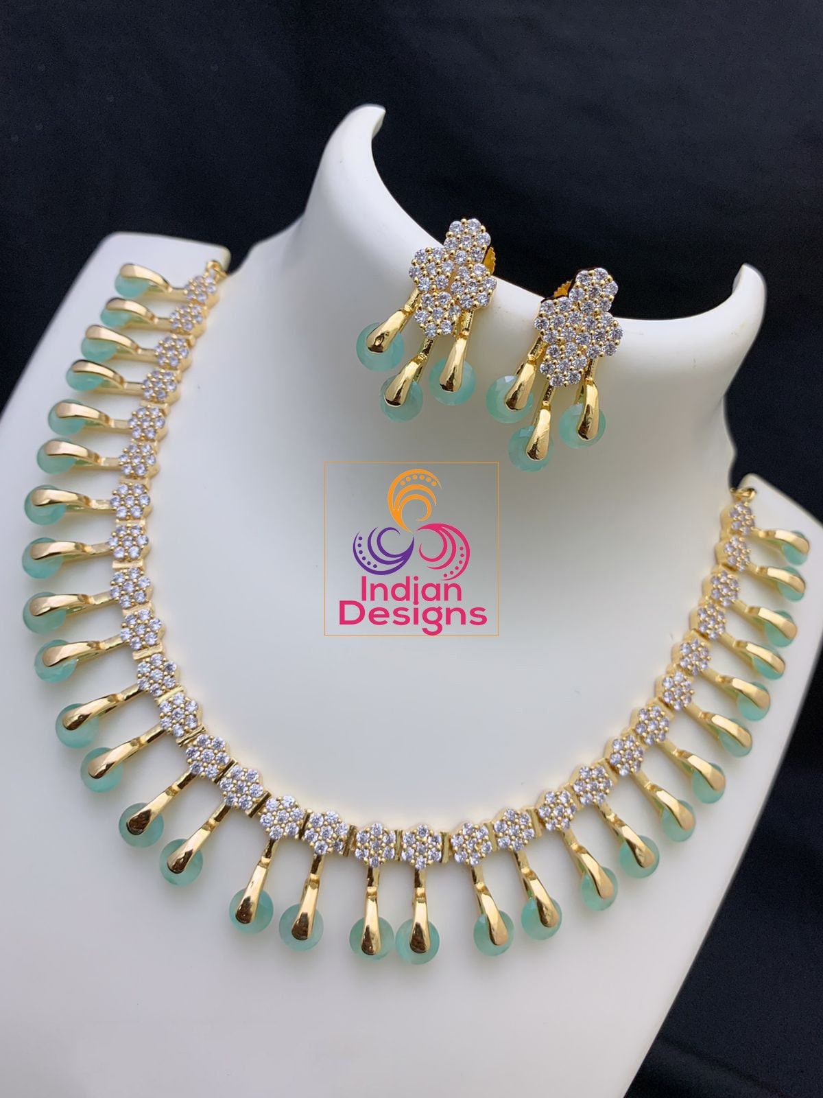 Unique and Exclusive CZ American Diamond necklace Earring set | Gold-plated American diamond necklace set with earrings |