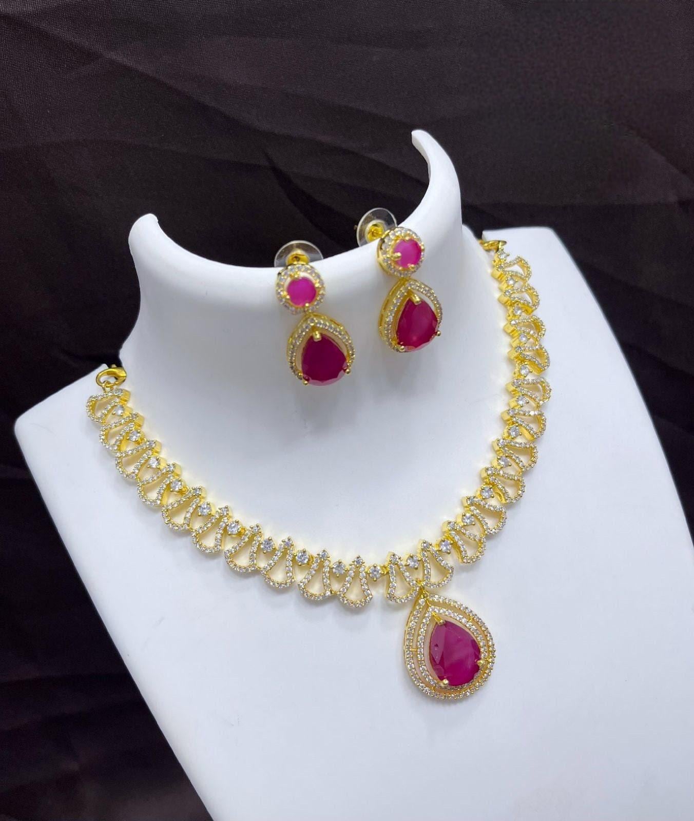 Tending gold plated american diamond necklace earring set | indian