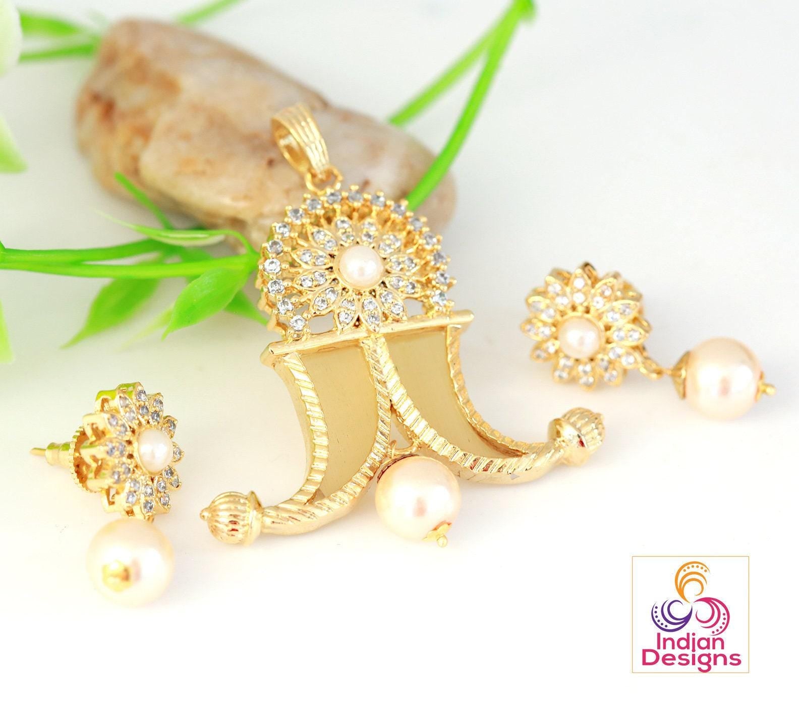 Gold plated puligoru pendant | american diamond tiger claw pendant designs | ad locket | cz pearl pendant | south indian jewelry designs