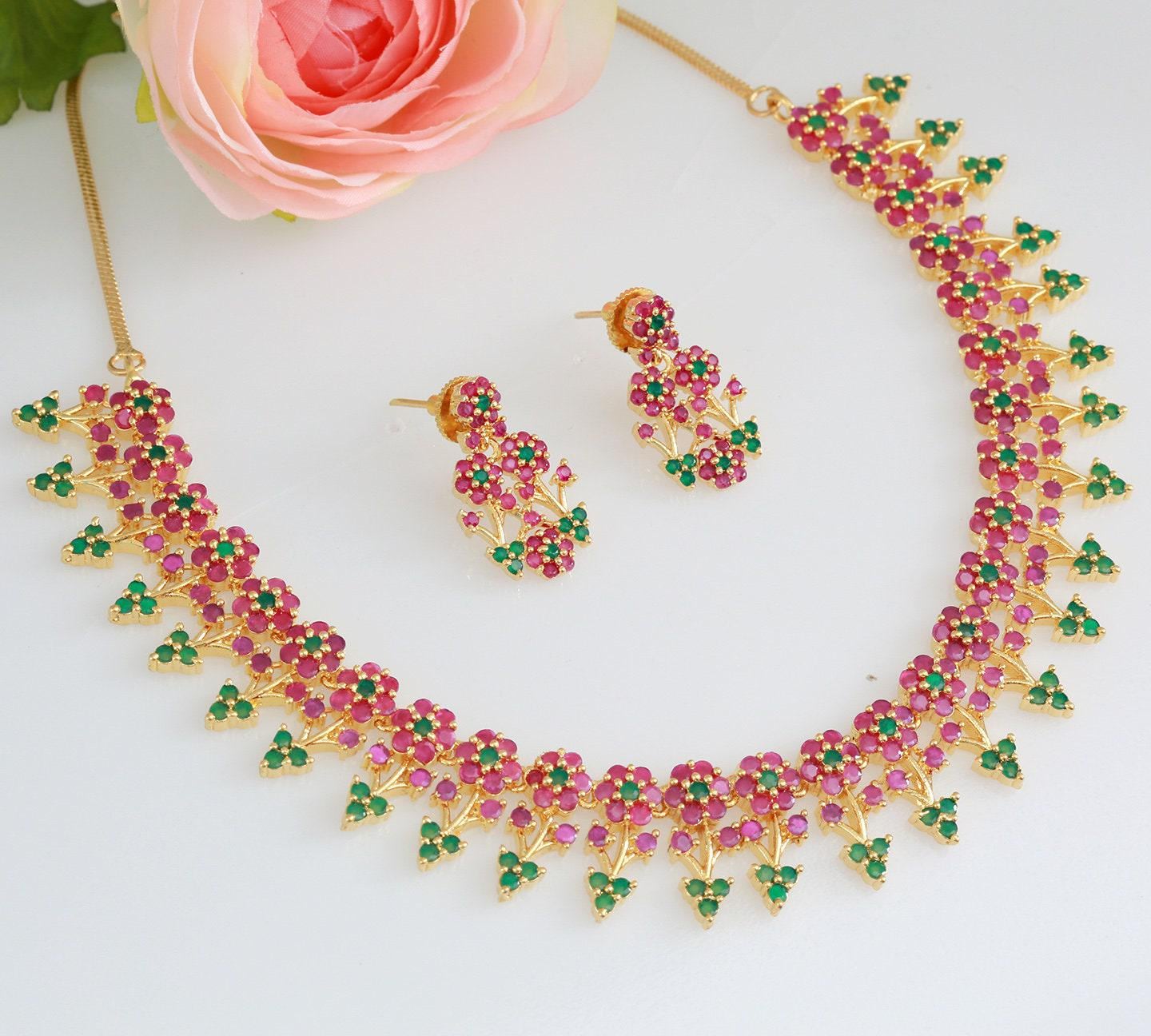 Designer necklaces | ruby emerald necklace indian designs | south indian necklace designs in floral design | gold tone necklace and earring