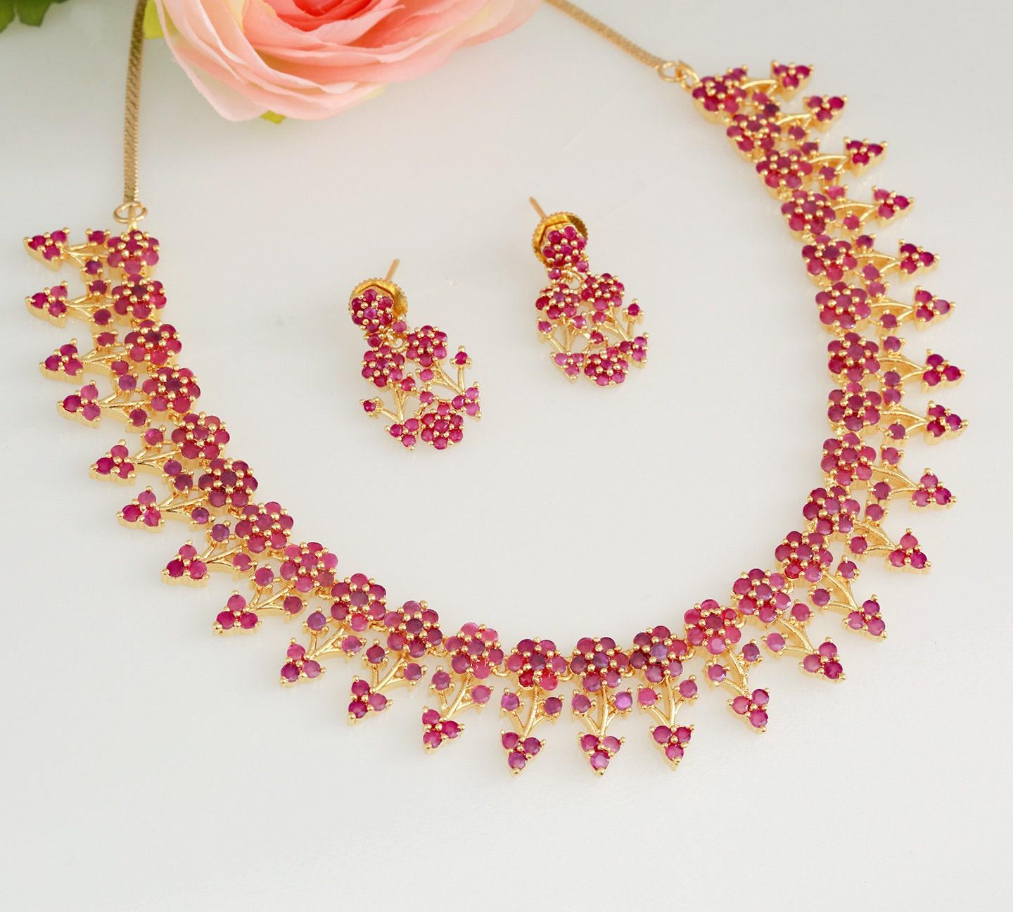 Designer necklaces | ruby emerald necklace indian designs | south indian necklace designs in floral design | gold tone necklace and earring