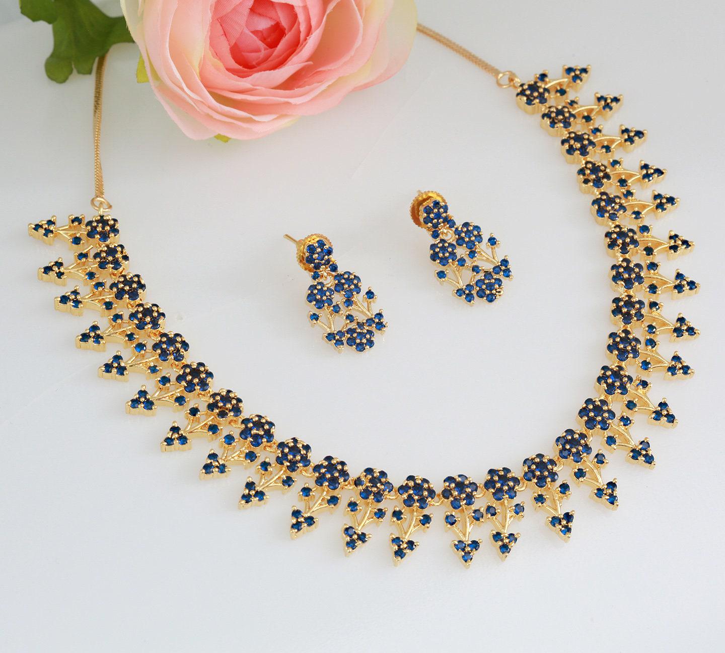 Designer necklaces | ruby emerald necklace indian designs | south indian necklace designs in floral design | gold tone necklace and earring