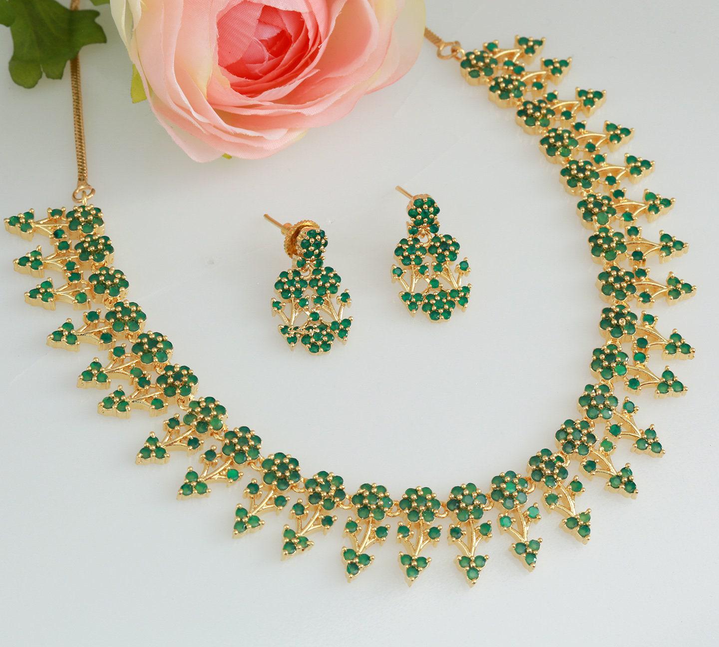 Designer necklaces | ruby emerald necklace indian designs | south indian necklace designs in floral design | gold tone necklace and earring