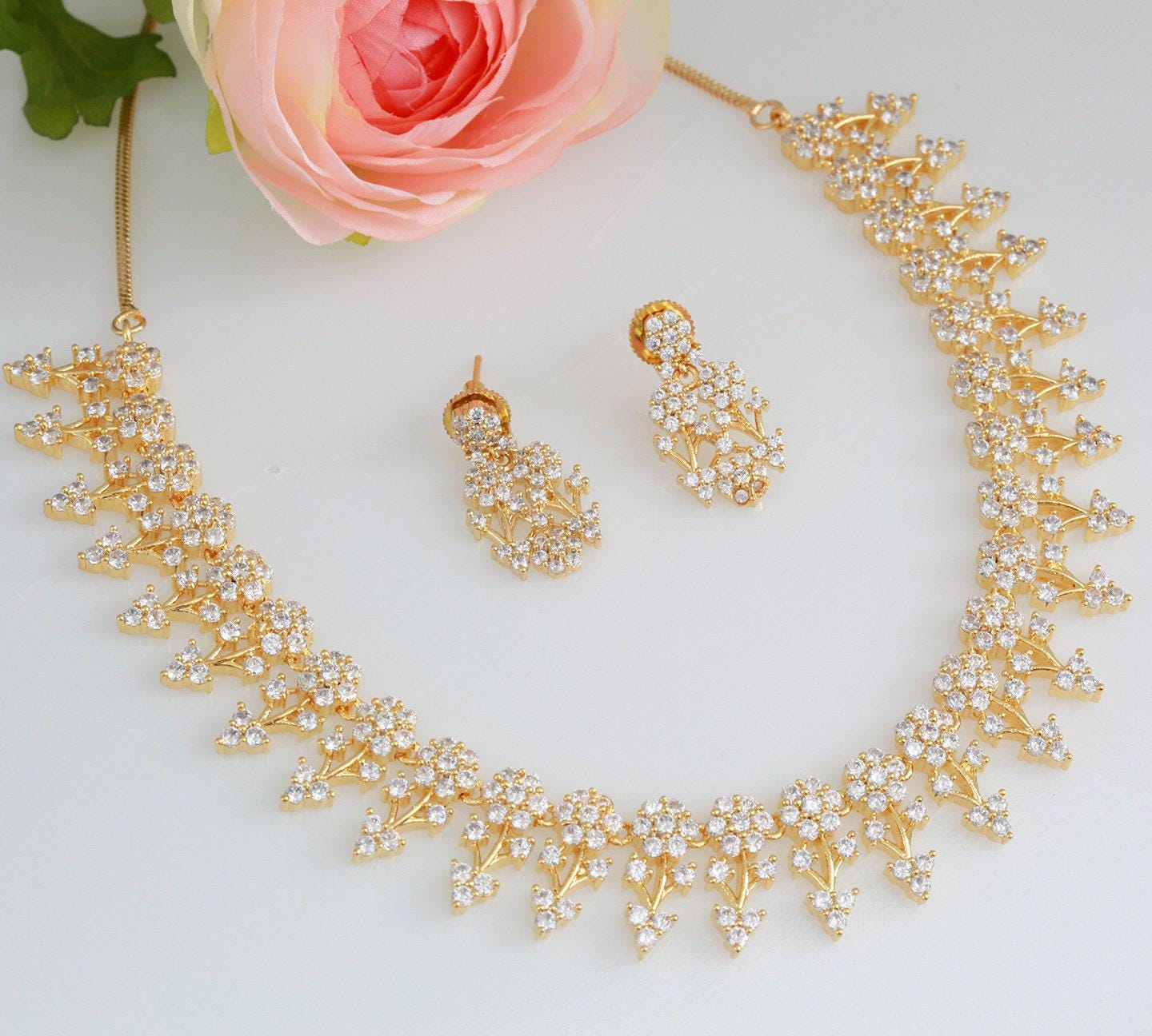 Designer necklaces | ruby emerald necklace indian designs | south indian necklace designs in floral design | gold tone necklace and earring