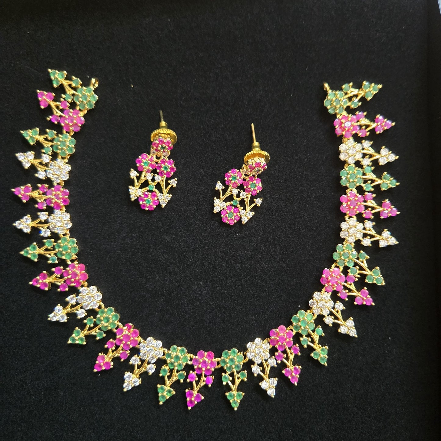 Designer necklaces | ruby emerald necklace indian designs | south indian necklace designs in floral design | gold tone necklace and earring