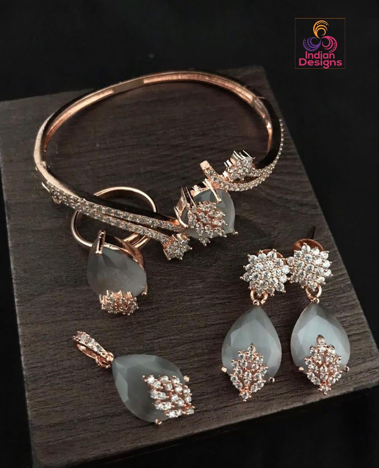 Grey stone Earrings, adjustable ring, pendant and bracelet in 18K Rose gold plating.