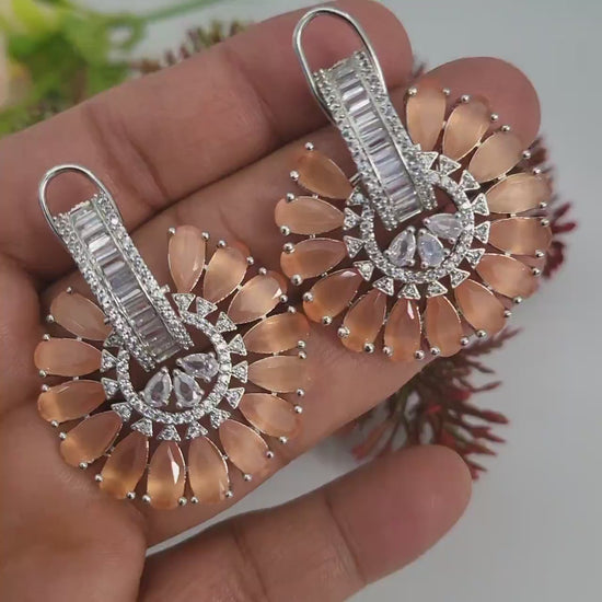 Big flower stud crystal earrings | ad stud earrings peach stones | rhodium plated american diamond stud earrings | bollywood style cz studs