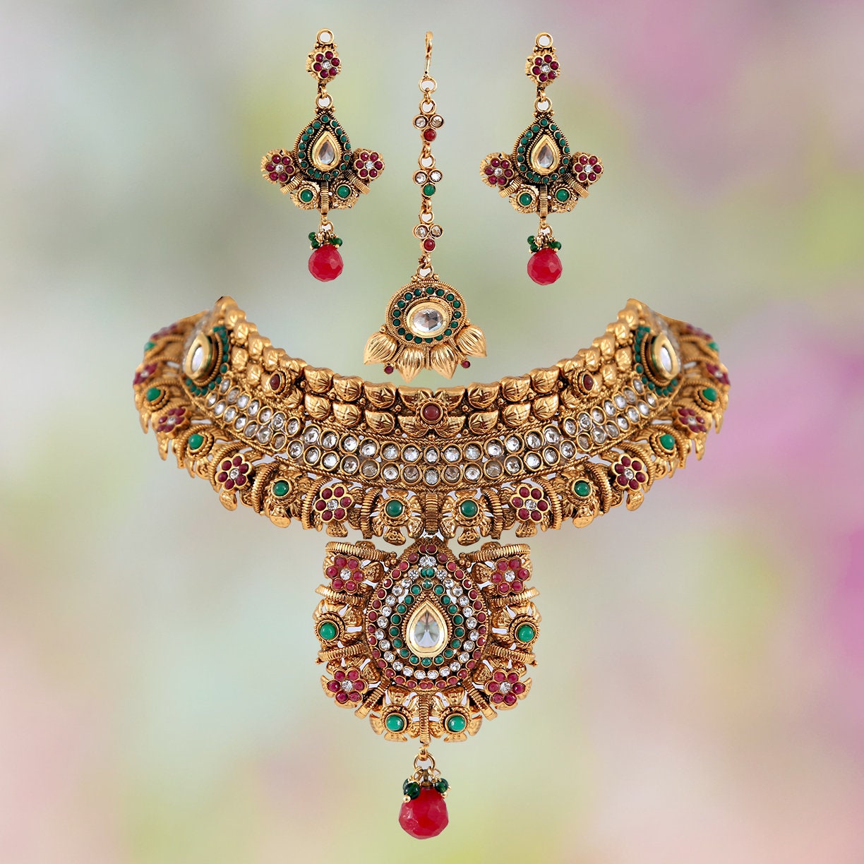 Studded designer elegant polki bridal jewelry set in golden background with Emerald,ruby and white stones