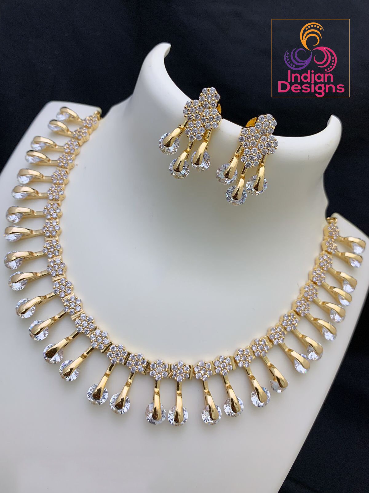 Unique and Exclusive CZ American Diamond necklace Earring set | Gold-plated American diamond necklace set with earrings |